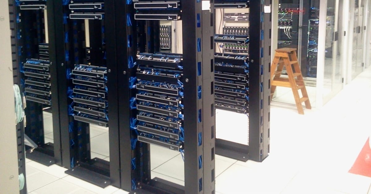 A row of servers in a data center, illustrating G4-MeroMero-31B