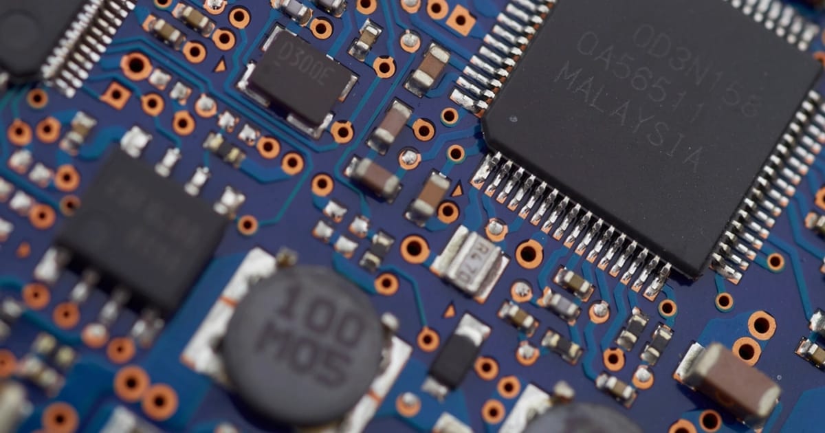 Macro view of a computer circuit board, illustrating LLM Guardrails