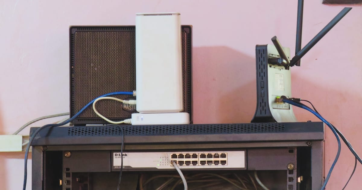 A network switch with connected Ethernet cables, illustrating LLM Safety