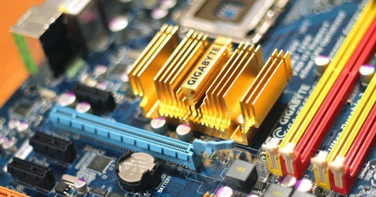 Close-up of a computer motherboard and circuitry, illustrating OpenAI's Under-18 Principles